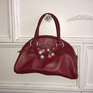 Adorable red handbag with sparkly accents